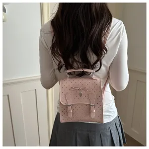 Pink polka dot mini backpack detail view, cute bow design, sweet daily style aesthetic bag