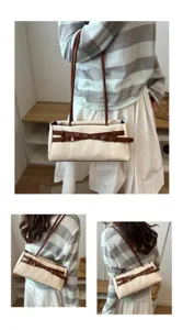 Detailed view of the sweet contrast belt canvas shoulder bag, stylish underarm design.