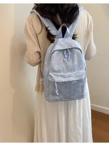 Cute light blue polka dot backpack with a clear front pocket for women and student daily use.