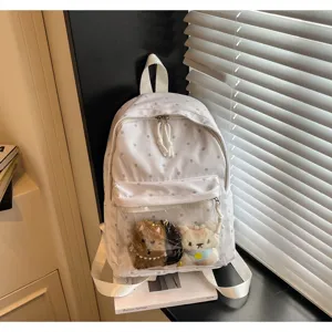White polka dot backpack with clear front pocket and cute plush toys for students daily casual.