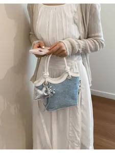 Korean style denim bucket handbag for women, chic summer commuter shoulder bag with star charm.