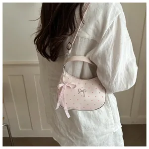 Bolso bandolera rosa de lunares de luna con bonito abalorio de lazo, bolso elegante de mujer.