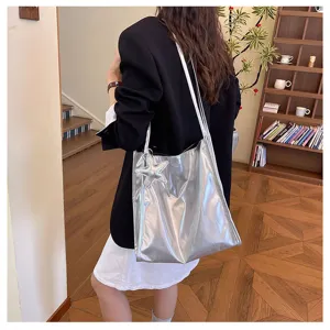 Glossy silver tote bag with star pendant, casual large capacity commuter shoulder bag.