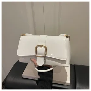 White patent leather shoulder bag, chic retro crossbody handbag with golden buckle.