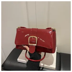 Korean retro solid color patent leather shoulder bag with chic metal buckle for women fashion.