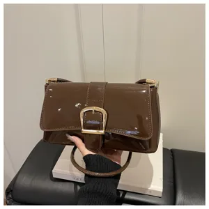 Brown patent leather shoulder bag for women, vintage square crossbody bag with metal buckle.