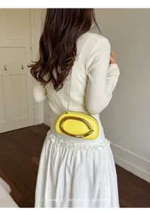 Mini yellow round box evening bag with gold metal handle and chain crossbody strap retro style