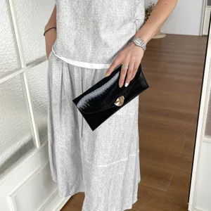 Stylish black pleated clutch bag for women, elegant evening envelope purse with gold hardware.