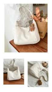 Chic white hobo shoulder bag for women, large capacity casual crossbody tote bag with bear charm.