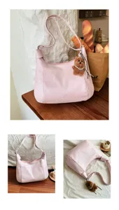 Pink large capacity shoulder tote bag for women, stylish casual commuter handbag with bear pendant.