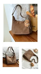Stylish brown large capacity shoulder tote bag with cute bear charm and perforated design.