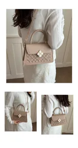 Detailansicht einer schicken Umhängetasche in Beige mit edlem Stickmuster und feinem Verschluss.