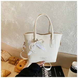 Trendy pendant bucket bag for women, large capacity solid color casual handbag for daily commute.