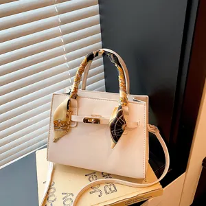 Elegant white women handbag with stylish scarf handle and cross-body strap for daily use