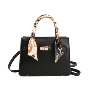 Classic black women handbag with stylish scarf decorated handle and elegant gold hardware design.