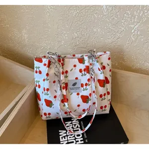 Stylish casual strawberry print canvas tote bag, large capacity everyday shoulder bag for women.