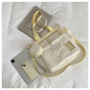 Korean style polka dot canvas crossbody bag with large capacity for daily student commute.