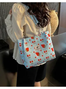 Blue cherry print canvas tote bag with chain strap, casual large capacity shoulder bag for use.