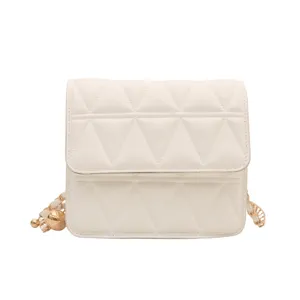 Stylish white quilted chain crossbody bag for women, trendy small square shoulder handbag.