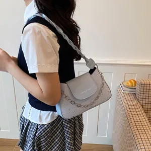 Light blue shoulder bag for women, stylish underarm bag with braided strap and chain.