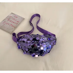 Purple sequin crossbody bag detail showing shimmering sequined fabric, wide strap and durable zipper.