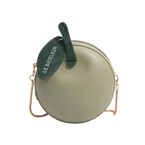 Trendy mini apple shaped crossbody bag for women, cute green shoulder bag with chain strap.