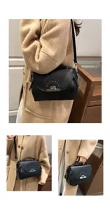 Sac bandoulière noir pour femme vue détaillée avec fermeture métallique et rivets stylés.