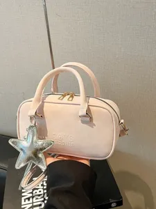 Pink boston shoulder bag for women with star charm, stylish PU leather crossbody handbag.
