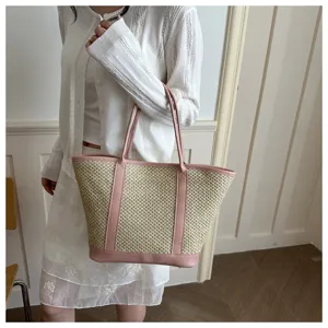 Detailed view of women's summer straw woven tote bag, stylish single shoulder bag for daily wear.