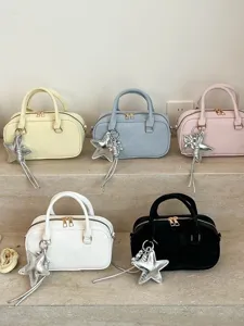 Stylish women's handbag with star charm, PU leather top handle cross body square bag main.