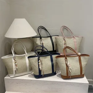 Stylish large capacity woven straw tote bag summer beach shoulder bag with chic charm decor.