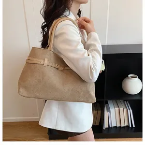 Minimalist retro large capacity shoulder tote bag in khaki suede with stylish belt decoration.