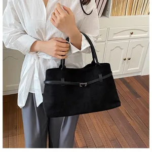 Close-up view of the black retro shoulder tote bag featuring a stylish buckle belt design.