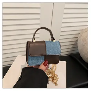 Trendy denim and leather color-block small crossbody handbag with chic chain strap for summer commute.
