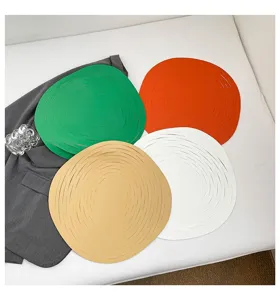 Circular hollow leather placemats set, colorful minimalist home table decor items.