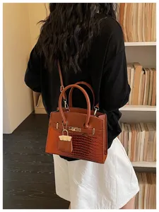 Stylish brown crocodile pattern shoulder bag, elegant top handle crossbody design for women.