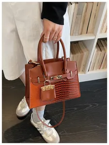 Stylish women top handle shoulder bag with crocodile pattern and contrast color design for daily wear.
