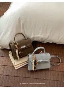 Sac à main pour femme et sac bandoulière élégant dans le style rétro Kelly.
