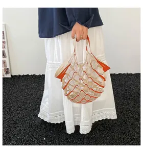 Leather mesh handbag featuring a chic hollow design, vibrant orange trim, and minimalist style.