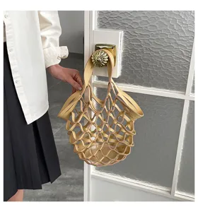 Detail shot of a beige leather mesh tote bag featuring a chic hollow-out casual design.