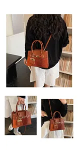 Chic brown colorblock patchwork handbag with crocodile texture, top handle & crossbody strap.