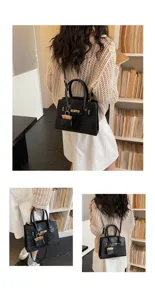 Black crocodile pattern handbag, stylish tote and crossbody bag with gold hardware for women.