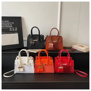 Stylish women handbag crocodile pattern shoulder crossbody bag with metal lock design.