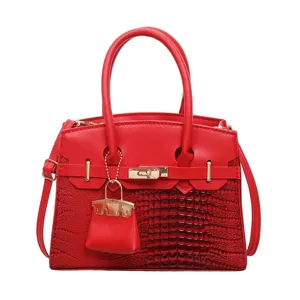 Red PU leather shoulder handbag with crocodile pattern, metal lock and top handles.