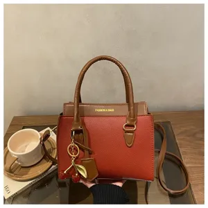 Stylish women colorblock shoulder crossbody bag with cute cherry pendant for daily wear.