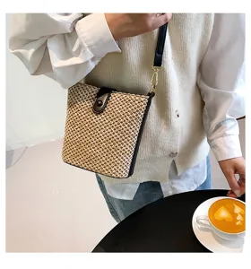 Stylish woven straw bucket bag for women summer casual crossbody shoulder handbag.
