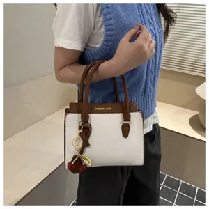 Women's contrast color top handle shoulder bag with cute cherry charm stylish handbag.
