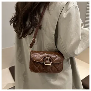 French luxury quilted crossbody bag for women, elegant brown leather shoulder bag with chic buckle.