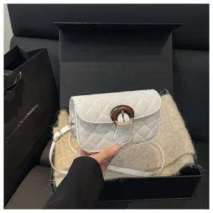Chic white quilted shoulder bag with wooden buckle detail, elegant design for daily use.