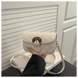 White quilted crossbody bag with stylish wooden buckle, elegant shoulder bag for women daily use.